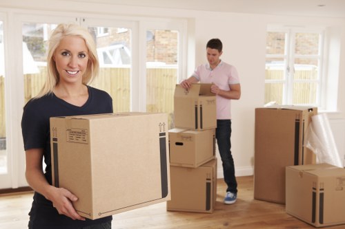 Professional movers handling furniture with care