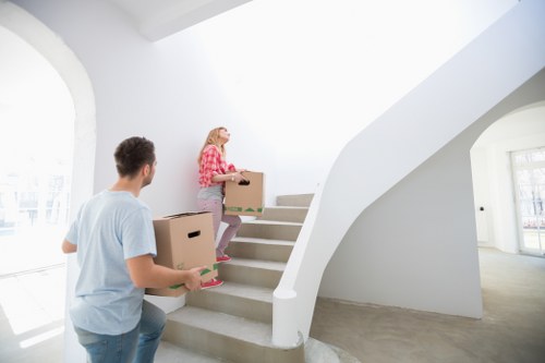 Volunteer sorting reusable furniture at a charity hub