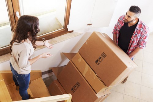 Professional house removalists unloading a moving truck in South London